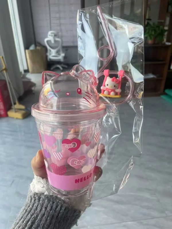 New cute Hello Kitty swing water cup with a cute Hello Kitty swing around the water cup at home