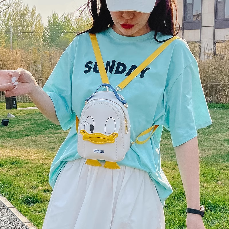 Handmade Donald Duck DIY crossbody bag worn by a model